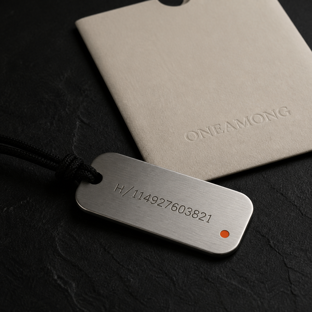 ONEAMONG brushed steel ID Tag with warm-bone sleeve