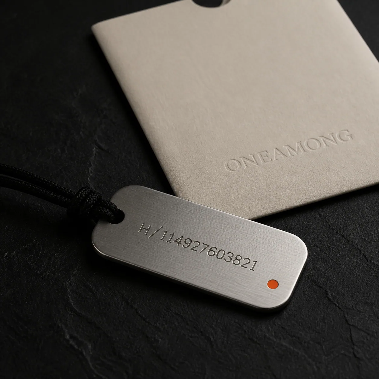 ONEAMONG brushed steel ID Tag with warm-bone sleeve